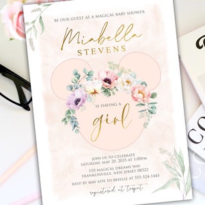 May include: A pink and gold baby shower invitation with a floral design and the text "Miabella Stevens is having a girl".