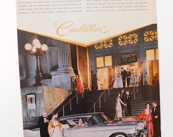 May include: A vintage advertisement for Cadillac featuring a silver car parked in front of a grand building with a group of people in formal attire. The text reads "No Man Is Ever a Stranger..." and "Cadillac".