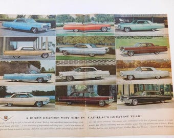 May include: A vintage advertisement for Cadillac cars featuring a dozen different models in various colors, including blue, red, and white. The ad highlights the Cadillac's greatest year, with the text "A Dozen Reasons Why This Is Cadillac's Greatest Year!" at the bottom.