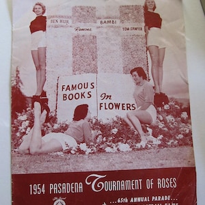 May include: Vintage 1954 Pasadena Tournament of Roses poster. The poster features women in shorts and tops standing on floral floats representing "Famous Books in Flowers." The poster is red and white with text that reads "65th Annual Parade... Rose Bowl Football Game A Mile of Christmas Trees."