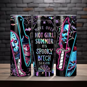 May include: A black tumbler with a spooky design featuring horror movie characters and the text "Move Over Hot Girl Summer It's Spooky Bitch Season". The tumbler has a black background with neon accents and spiderwebs.