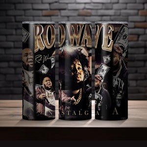May include: A black and gold stainless steel tumbler with a graphic of Rod Wave, a rapper, and the words "Rod Wave" and "Nostalgia" on it.