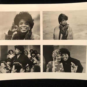 May include: A black and white photo collage featuring a woman in four different poses. The woman is wearing a variety of outfits, including a jacket, a scarf, and a dress. The photos are arranged in a grid pattern.