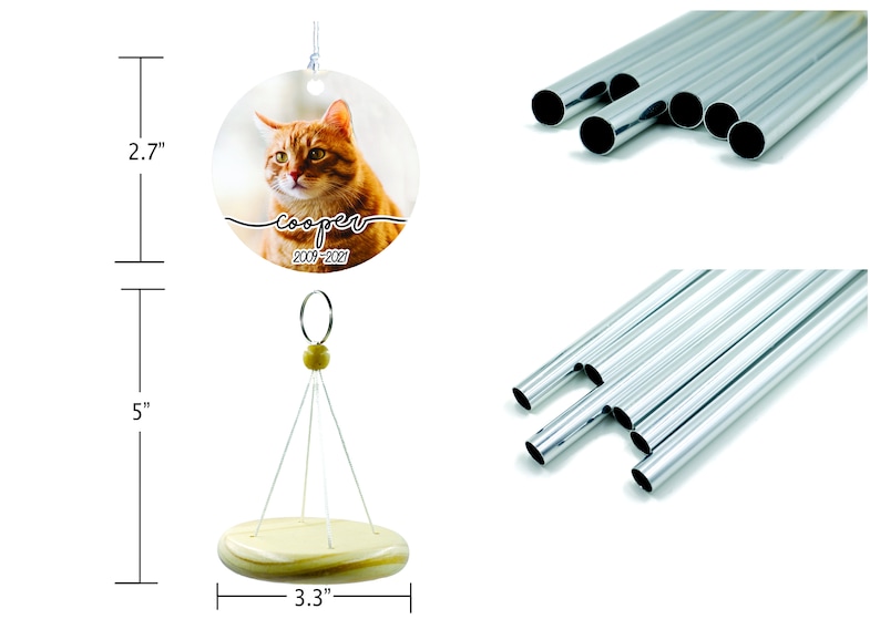 May include: A personalized wind chime featuring a round pendant with a cat portrait and the name "cooper" with dates 2009-2021. The wind chime is 5 inches tall with a 3.3-inch wooden base. Includes silver-colored metal tubes.