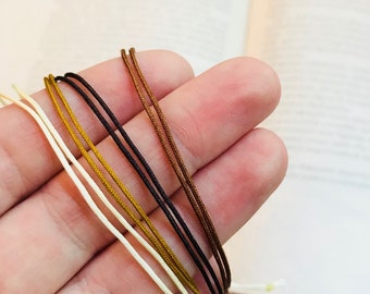 Pulsera de cordón de nailon impermeable, tobillera ajustable, diseño minimalista unisex.
