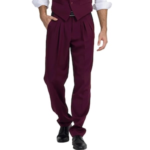 May include: A pair of burgundy pleated pants with a black belt.