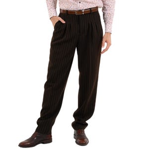 May include: Brown striped dress pants with a brown leather belt.