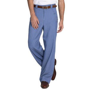 May include: Light blue wide-leg pants with a brown leather belt. The pants have a classic design and are made of a lightweight fabric. The model is wearing brown leather shoes.