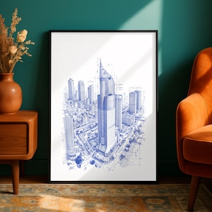 Op de afbeelding: Een ingelijste architecturale print met een blauwe inkttekening van een stadssilhouet met een prominente centrale wolkenkrabber. De tekening bevat technische lijnen, maatmarkeringen en structurele details van de gebouwen op een witte achtergrond.