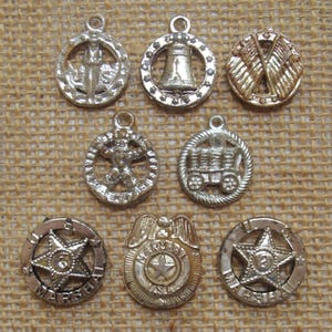 YOU CHOOSE vintage silvertone plastic medallion charm - 7/8" - Uncle Sam, Liberty Bell, astronaut, etc - cracker jack gumball prize toy