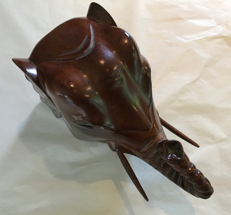 Elephant\u2019s head shaped carved wood box