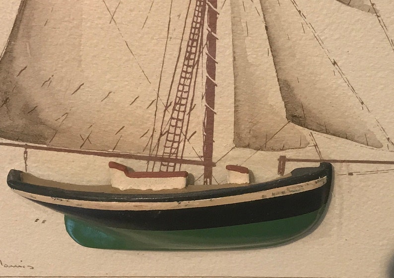 May include: A close-up of a wooden model ship with a black and green hull, white trim, and a brown mast. The ship is set against a beige background with a faint drawing of a sailboat.