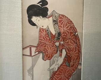 Japanese print, woman turning off a light, Kunisada