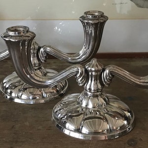 Beautiful pair of two-branched candlesticks in art deco silver metal
