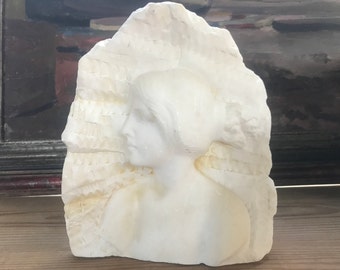 Marble sculpture, woman’s head in profile