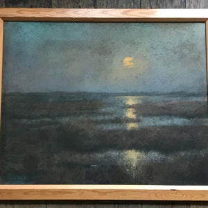 May include: A framed painting depicting a moonlit landscape with a large, bright moon reflecting on the water. The painting is done in muted tones of blue, green, and brown.