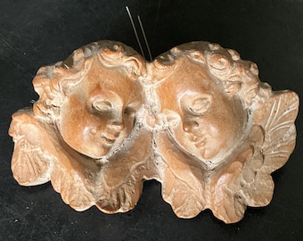 2 têtes d’angelots ailés en bois sculpté, origine italienne