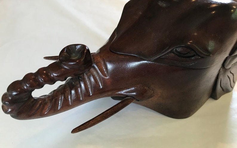 Elephant\u2019s head shaped carved wood box