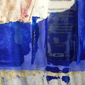 May include: A close-up of a blue and white label with the text "This product is one of the RG 512 Collection. Our collection has been designed to answer your customer's demand with special care regarding design, material and comfort."  The label also includes the text "AUTHENTIC GARMENT REGISTERED" and the logo "RG 512".