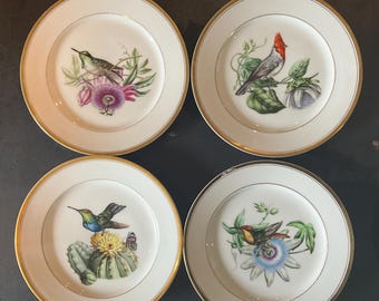 Hand-painted porcelain dessert plates, decorated with birds by A. Depret