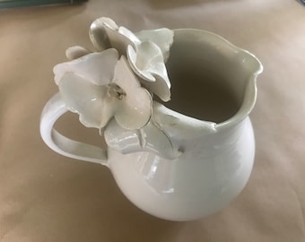 Barbotine pitcher with flowers and grapes