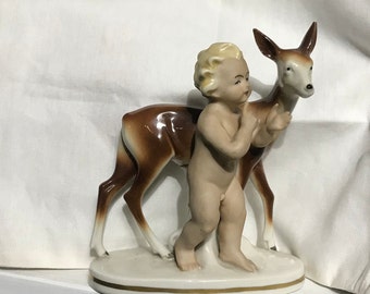 Nice china figurine of a child with a fawn