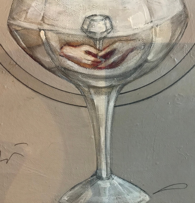 May include: A clear glass goblet with a thick stem and a wide bowl. The bowl is filled with a clear liquid and a small, clear crystal is suspended in the centre. The crystal is casting a shadow on the bottom of the bowl.