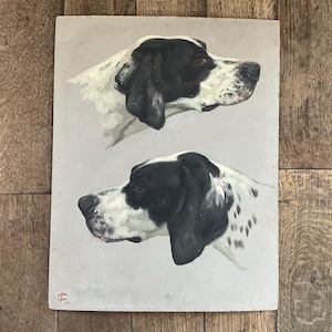 May include: An antique painting featuring two side profiles of a dog's head. The dog has black and white markings, with a black ear and eye area. The background is a light gray, and the artwork is on a rectangular canvas.