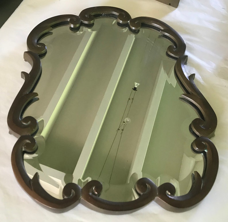 Bevelled mirror with brass frame image 1