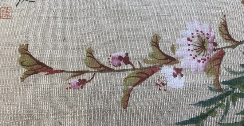 May include: A delicate branch of pink and white flowers with green leaves painted on a beige fabric background.