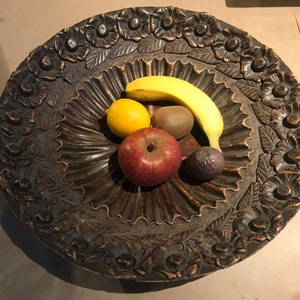 Large round carved wooden fruit dish