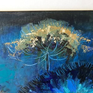 May include: Abstract painting of a large, white flower with blue and green accents against a dark blue background.