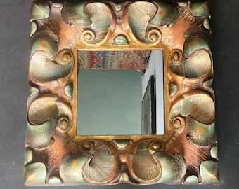 Mirror with carved and patinated wooden frame