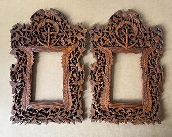Pair of openwork wooden frames.