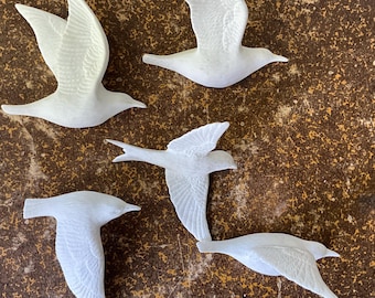 White porcelain figurines. Swallows, set of 5