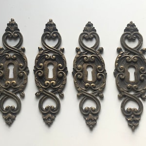 Elegant set of 6 metal keyholes circa 1900