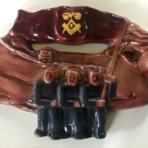 Ceramic wall decor, men with flag, René Boschman for Cocéram