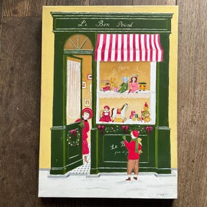 Puede incluir: Pintura acrílica de una fachada de juguetería con el texto "Le Bon Point". La tienda tiene un exterior verde, un toldo a rayas rojas y blancas y un escaparate de juguetes. Una persona con abrigo y sombrero rojo está en la puerta.