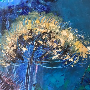 May include: Abstract painting with a large, white, and gold flower-like shape in the center. The flower is surrounded by blue and black brushstrokes on a dark blue background.