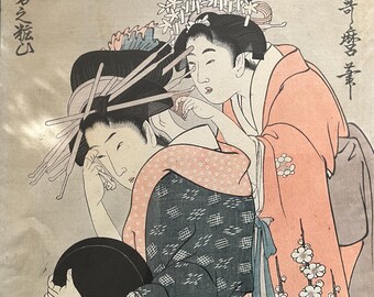 Courtesan applying makeup, Utamaro