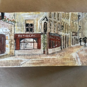 Painted brick, cityscape in the rain
