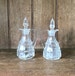 Pair of small glass carafes used for oil and vinegar 