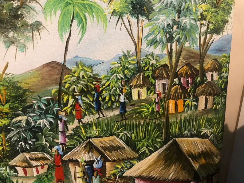 May include: A colorful painting depicting a village scene in a tropical setting. The painting features lush green foliage, palm trees, and thatched-roof huts. There are several figures in the painting, some carrying baskets on their heads, walking along a path.