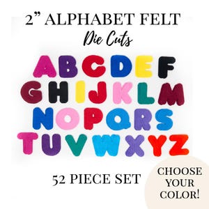 May include: A collection of 2-inch felt alphabet die cuts in various colors, including pink, purple, red, yellow, and blue. The image displays the letters A through Z, with the text "52 PIECE SET" and "CHOOSE YOUR COLOR!" on a white background.