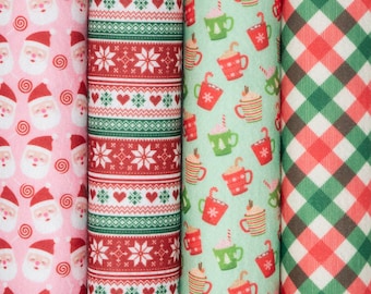 May include: Three fabric swatches with different Christmas patterns. The first is pink with a white Santa Claus and red candy canes. The second is red and green with a snowflake and heart pattern. The third is green and red with a white mug and candy cane pattern.