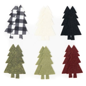 May include: Six felt Christmas tree ornaments in various colors and patterns. The ornaments are black and white gingham, white, black, green, and red.
