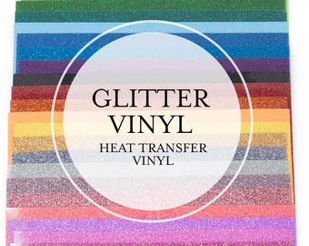 May include: A stack of glitter vinyl sheets in various colors, including green, blue, purple, orange, and pink. The text "GLITTER VINYL HEAT TRANSFER VINYL" is displayed in a white circle.