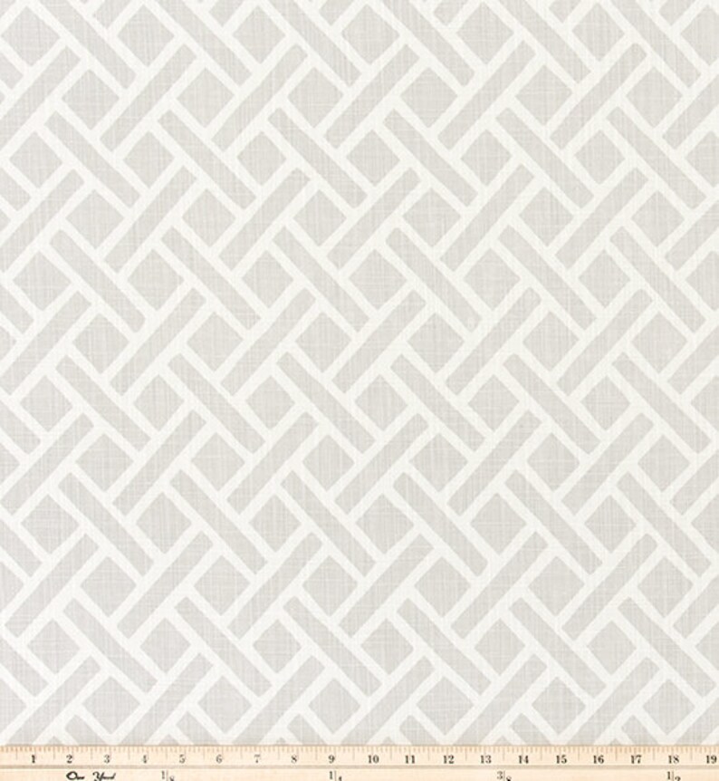 May include: White fabric with a geometric pattern of woven squares and rectangles. The fabric has a subtle linen texture.