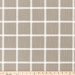 May include: A neutral-toned fabric with a grid pattern. The fabric has a light brown background with a white grid overlay. The grid lines are evenly spaced, creating a clean, modern design. Suitable for various home decor projects.