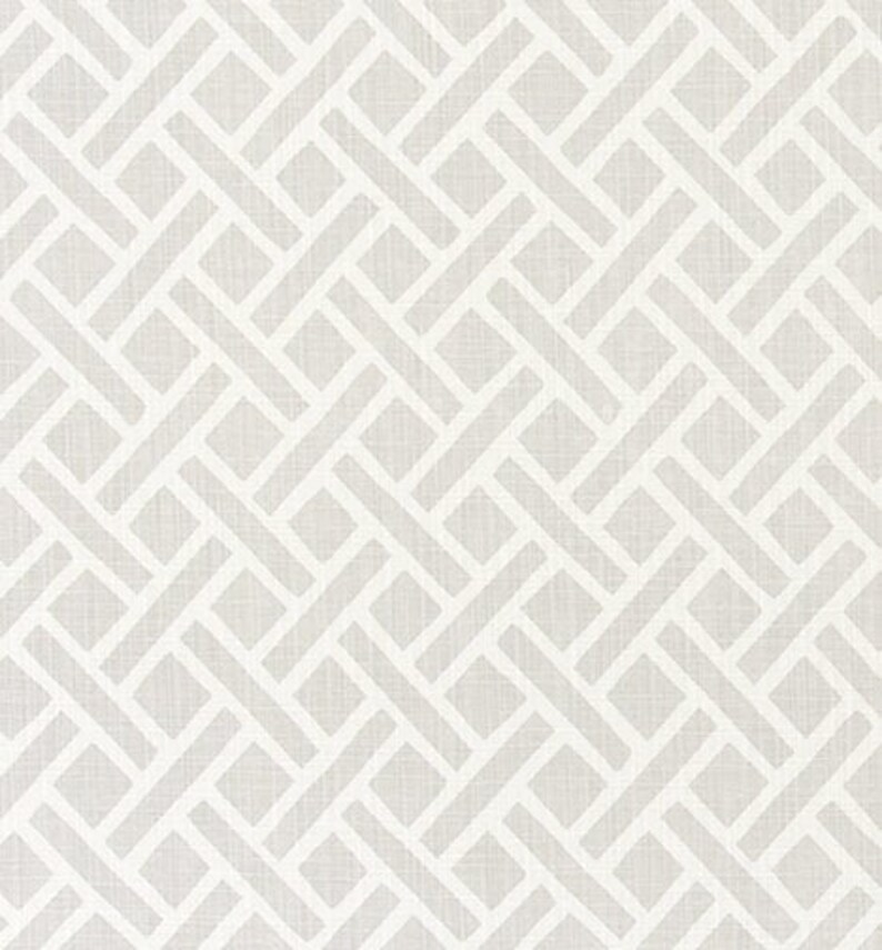 May include: A white and gray geometric pattern with a woven texture. The pattern is made up of overlapping squares and rectangles.